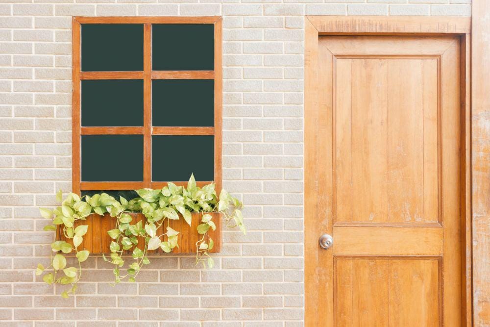 https://www.pexels.com/photo/photo-of-wooden-door-near-window-887822/
