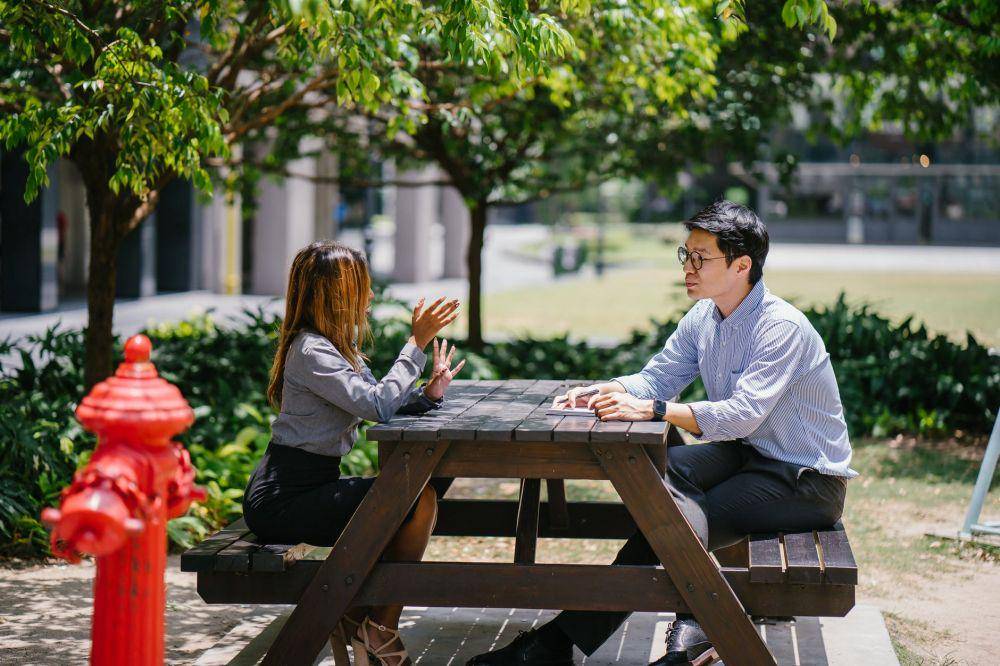 man and woman talking